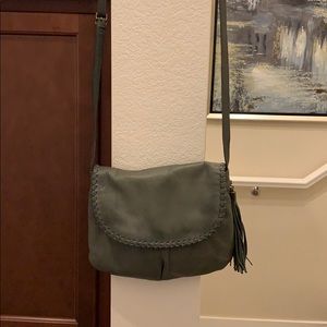 A gray cross body Hobo bag